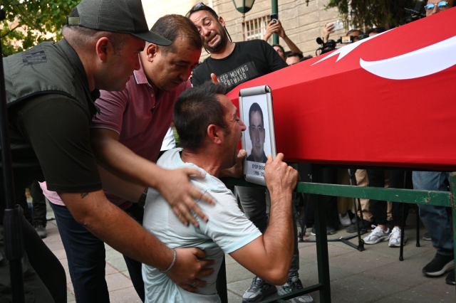 The son of the fire martyr cried, 'Dad, what will I do without you?'