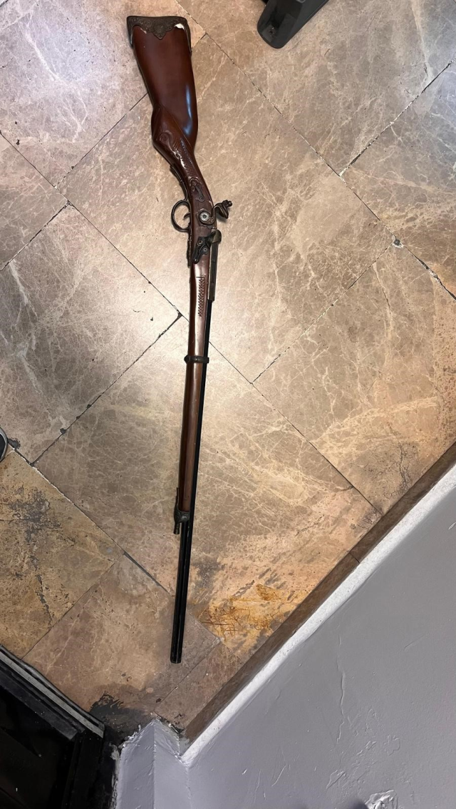 A person in a rabbit costume, holding a toy rifle, was taken into custody after getting on the metro