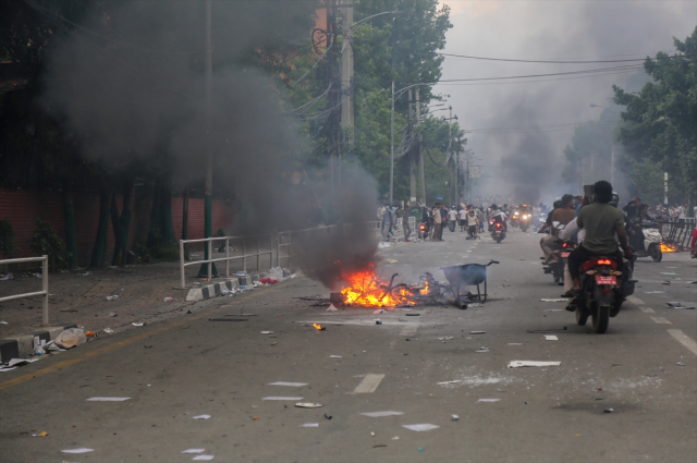 The death toll in Nepal, which has turned into a fire zone due to protests, has risen to 30