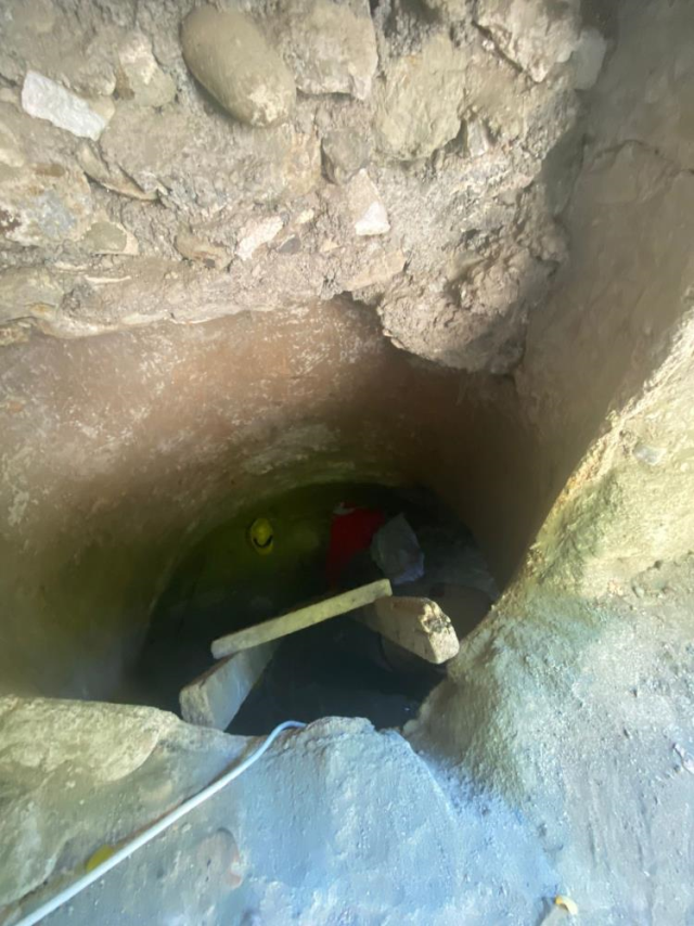 A woman who saw treasure in her dream was caught digging a tunnel under a 5-story apartment building with her son