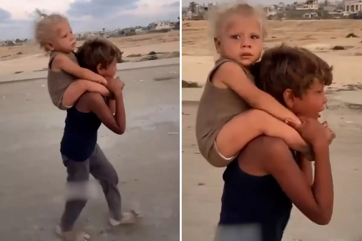 Gazze'den kahreden g�r�nt�: S�rt�ndaki karde�iyle a�layarak g�� etti