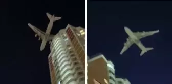 Dünyanın en büyük kargo uçağı droneden kaçarken az daha binalara çarpıyordu