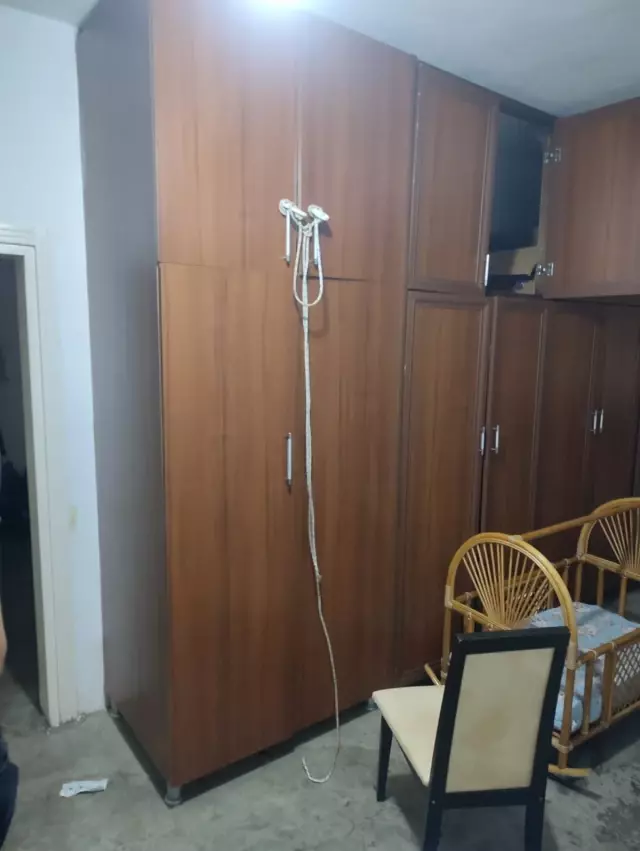 The woman, a mother of two, was found hanging in the closet