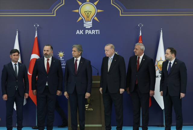 'If the people command, I will do it,' he said, kissing Erdoğan's hand and joining the AK Party