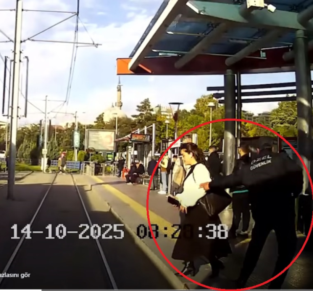The security officer saved her from being under the tram; those moments were captured on camera