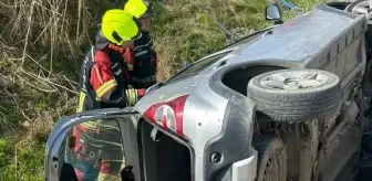 Burhaniye'de Otomobil Dere Yatağına Devrildi