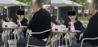 Vahim görüntüler! Küçücük çocuk ailesinin yanında sigara içti, bir de halka çıkardı