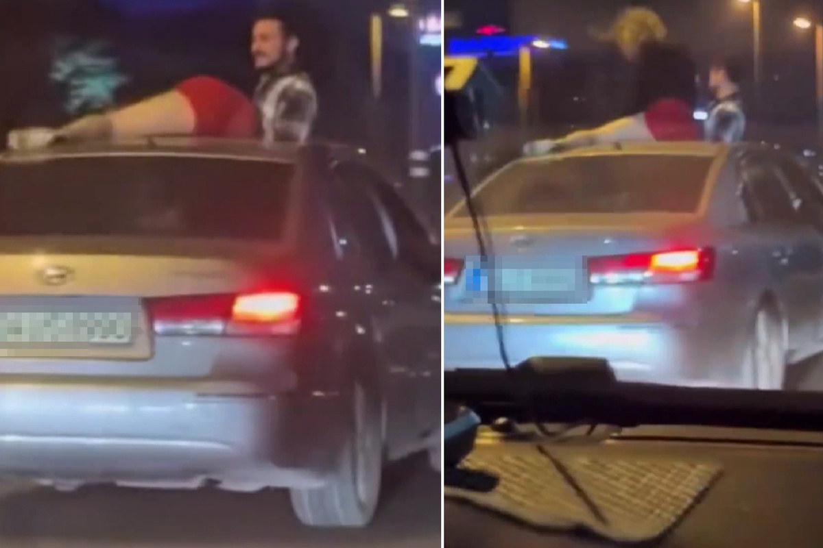 Seyir halindeki otomobilin tavanında twerk yapmaya çalıştı