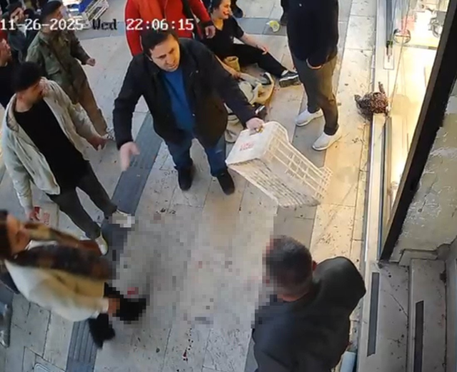 The woman who was stabbed was rescued by shopkeepers with fruit crates