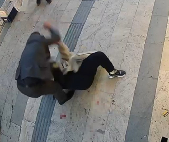 The woman who was stabbed was rescued by shopkeepers with fruit crates