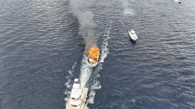 Moments of the luxury yacht burning off Kalkan captured by drone