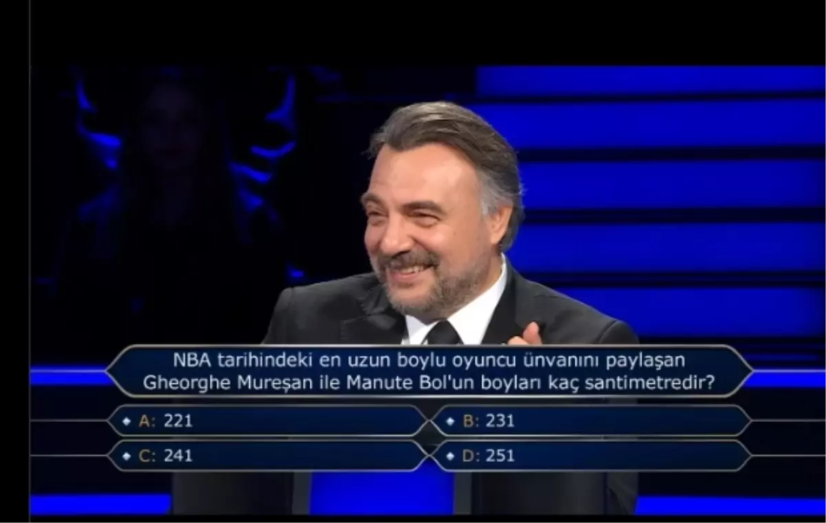 NBA tarihindeki en uzun boylu oyuncu ünvanını paylaşan Gheorghe Mureşan ile Manute Bol'un boyları kaç santimetredir?