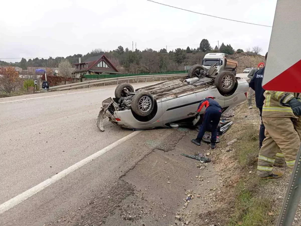 Takla atan otomobilden yara almadan kurtuldu