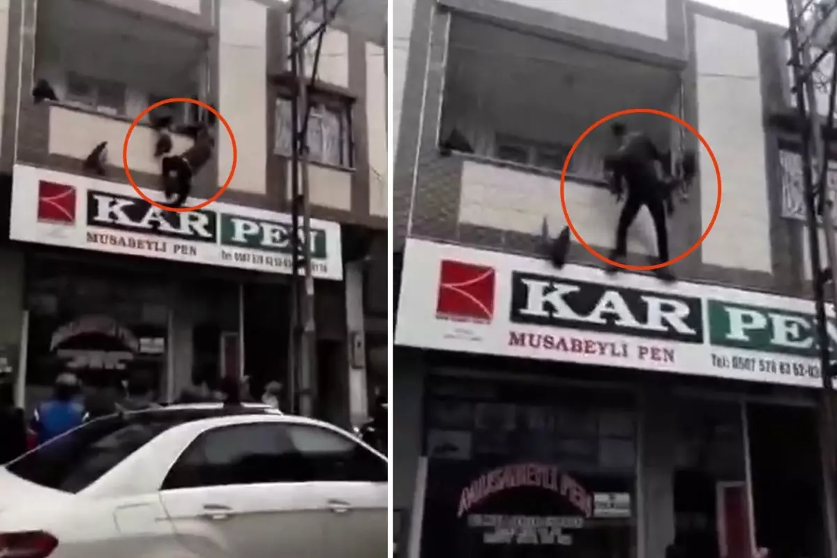 Balkon demirlerine asılı kalan çocuğu sokaktaki kahraman kurtardı