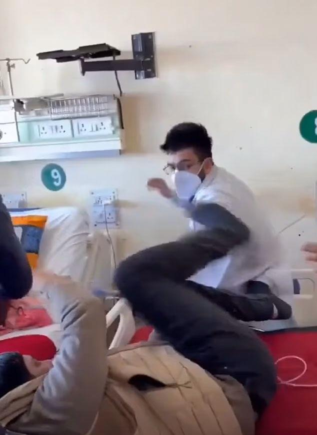 The doctor punched the patient for lying on the bed
