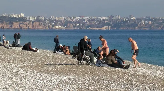 They sunbathed and swam in the sea on the first weekend of the year