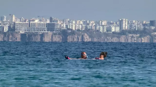 They sunbathed and swam in the sea on the first weekend of the year