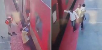 Trene yetişmeye çalışırken kucağındaki çocukla tren ve peron arasında sıkıştı