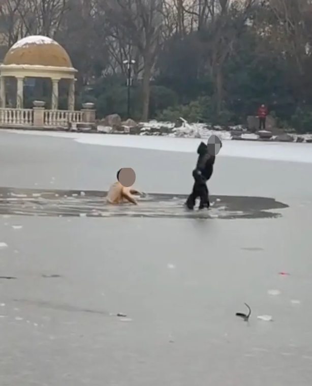 The hero man saved the child who fell into the frozen lake