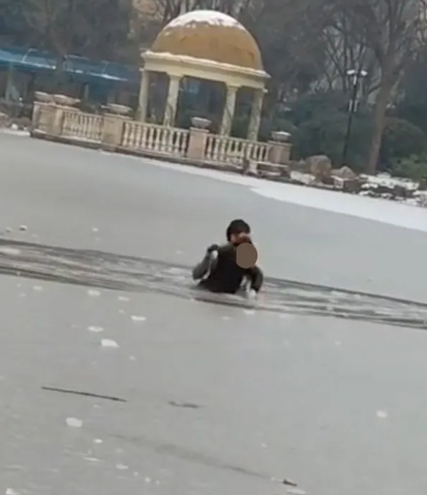 The hero man saved the child who fell into the frozen lake