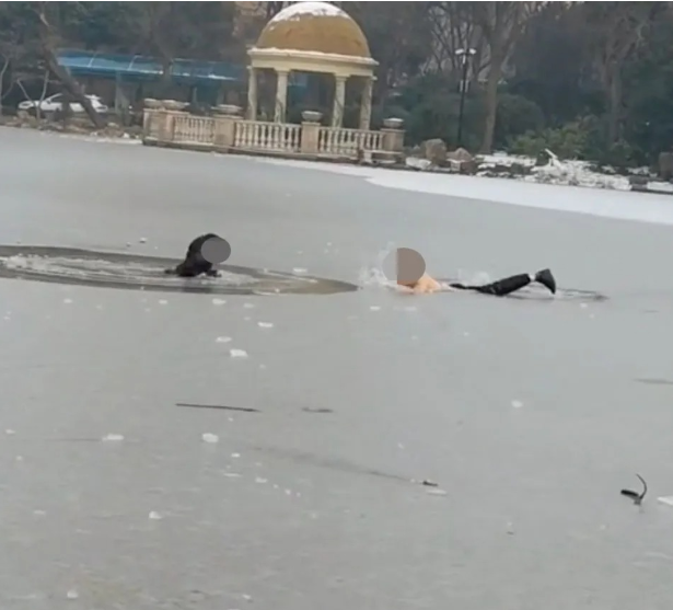 The hero man saved the child who fell into the frozen lake