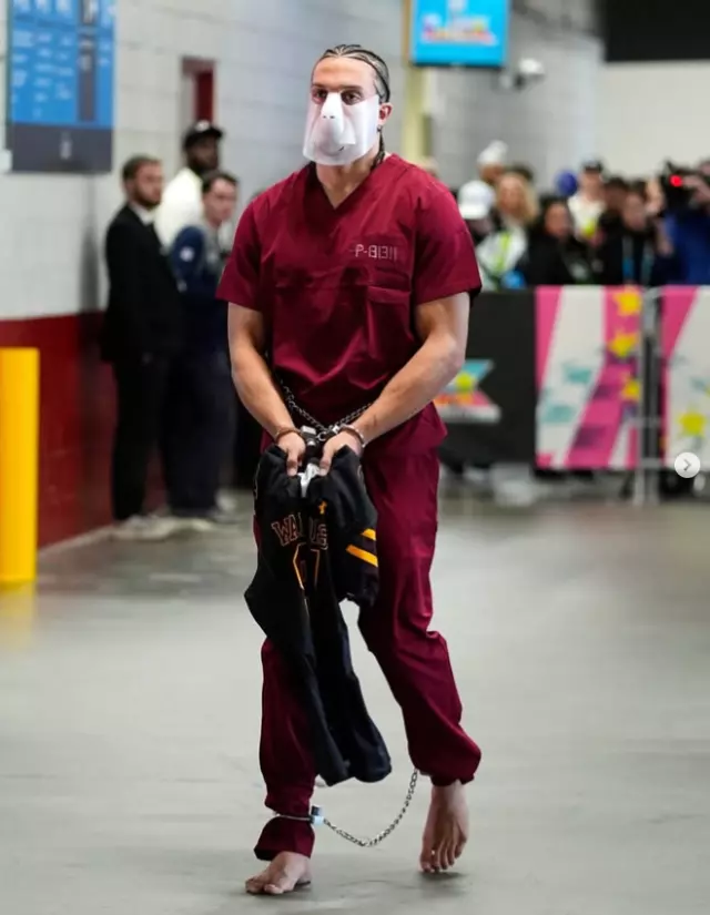 ICE protest in prison attire by NFL star at Super Bowl