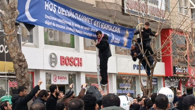 The 'Ramadan' banner that stirred the city: Chaos ensued when the teams tried to take it down