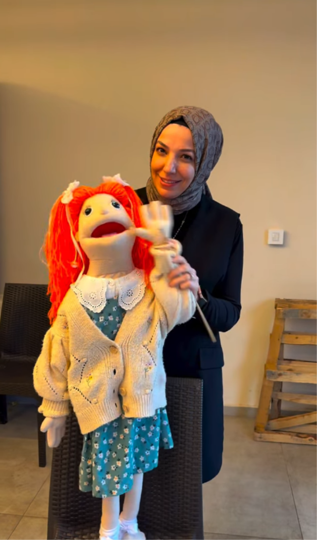 A teacher and a puppet