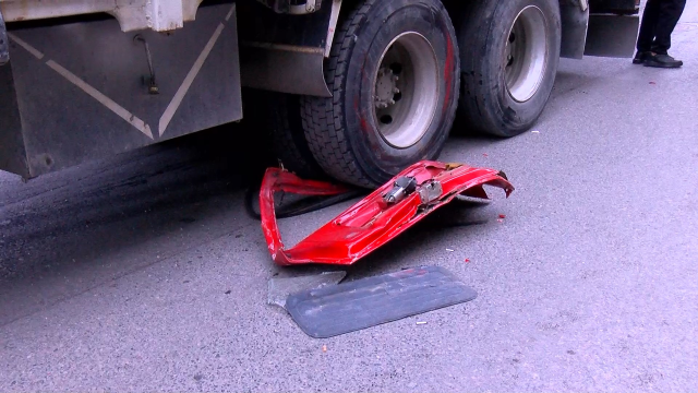 Another view of the damaged vehicles after the accident