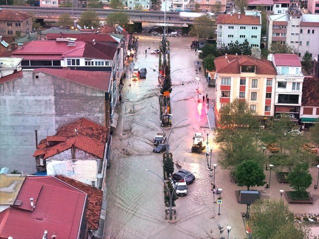 Vehicles and containers swept away during floods
