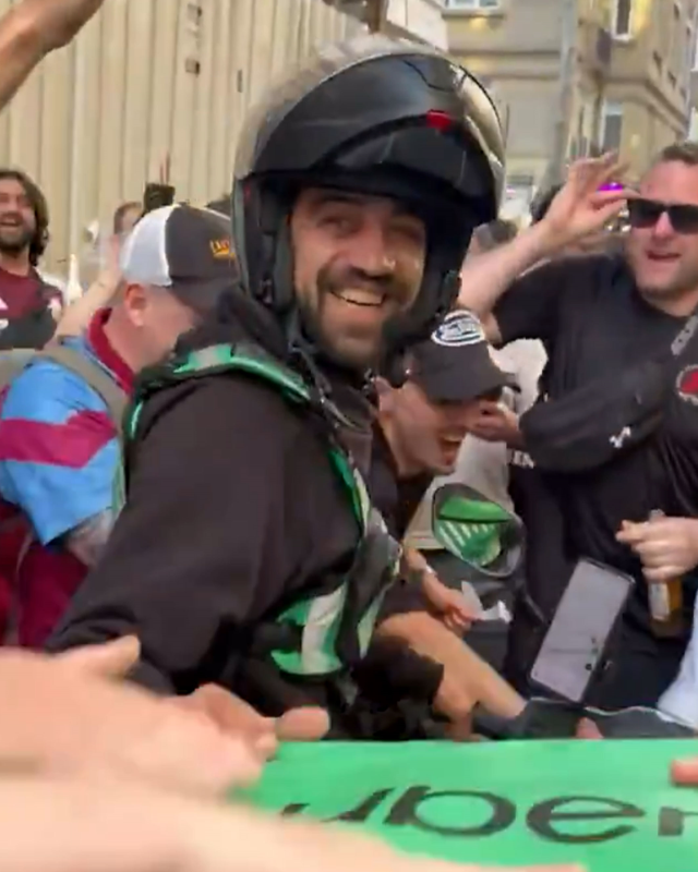 Aston Villa fans chant with courier