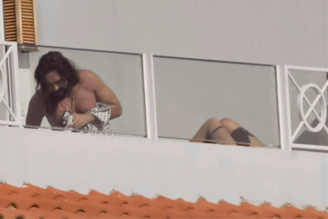 Heidi Klum topless sunbathing