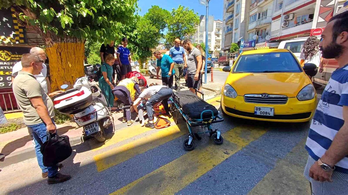 Efeler'de yolun karşısına geçmek isteyen kadına taksi çarptı: 1 yaralı