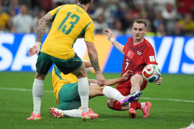 Turkish and Paraguay players competing for the ball