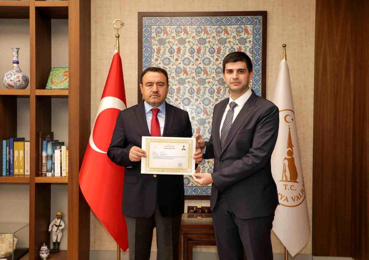 Vali Işın'dan Kaymakam Teltik'e başarı belgesi