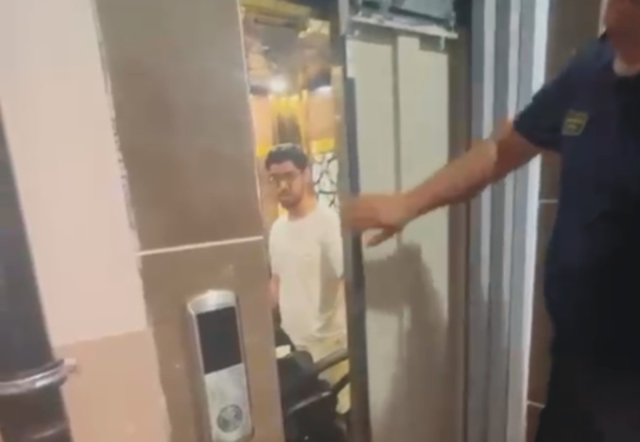 Young man stuck in elevator