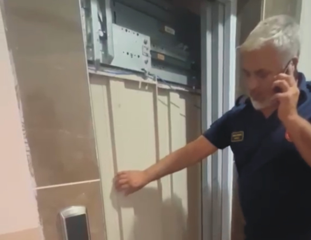 Firefighters rescuing student from elevator