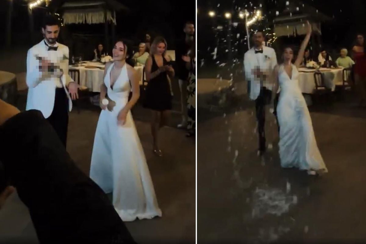 Düğünde dans eden damat gelini yere düşürürken çekilmiş bir görüntü.