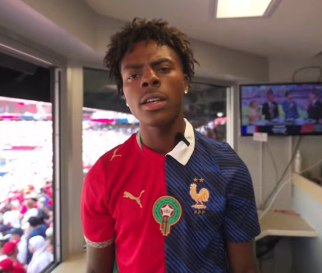 IShowSpeed wears a combined France and Morocco jersey during the World Cup quarterfinal match