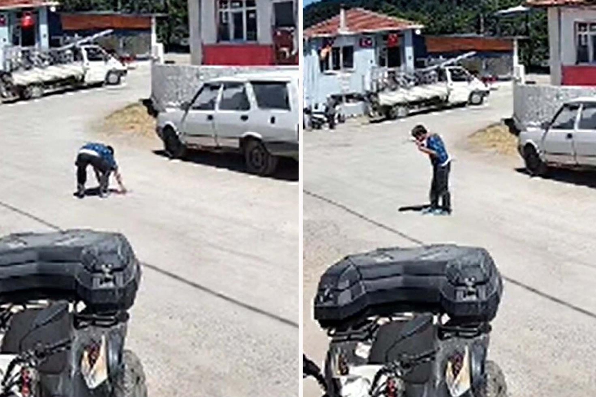 Yere düşen Atatürk portresini öpüp kaldırdı; o anlar kamerada