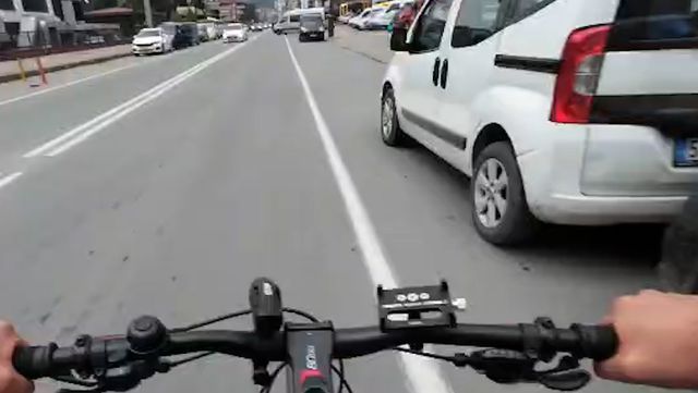 Cyclist attacked by two people getting out of car
