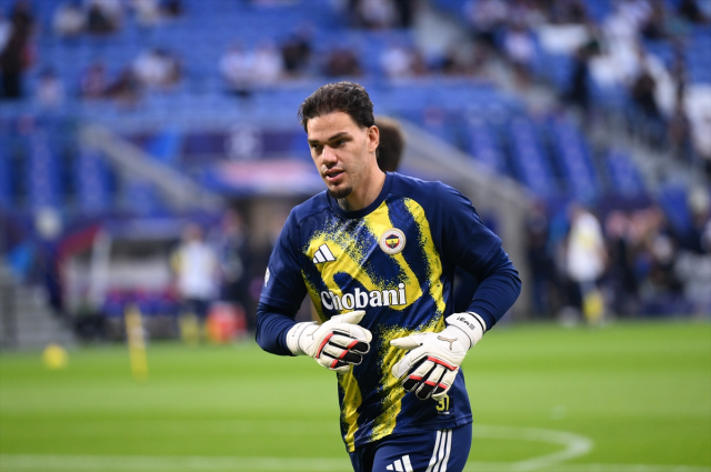 Ederson making a save during the Lyon match