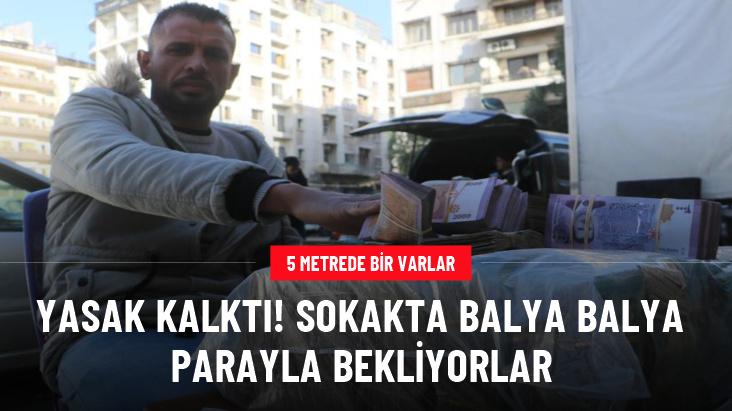 Suriye'de sarraflar sokaklarda balya balya para bozuyor