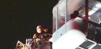 Dönme dolapta mahsur kaldılar, 9 saatlik operasyonla kurtuldular