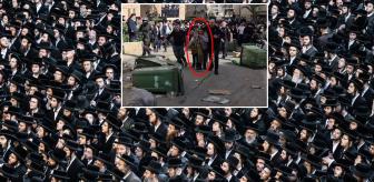 2 kadın polisi, kalabalık grubun elinden binbir güçlükle aldılar