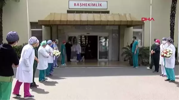 KORONAVİRÜSÜ YENEN DOKTOR ALKIŞLARLA TABURCU EDİLDİ