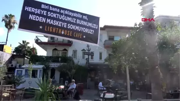 MUĞLA Kafeteryasının girişine maske farkındalığı için pankart astı