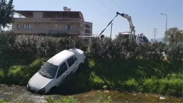 AYDIN'DA OTOMOBİL KANALA UÇTU, SÜRÜCÜ ŞANS ESERİ YARA ALMADI