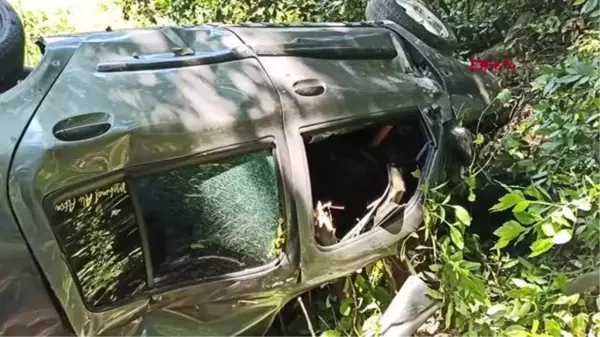 20 metreden uçan otomobilin sürücüsü, arkadaşını arayıp yardım istedi