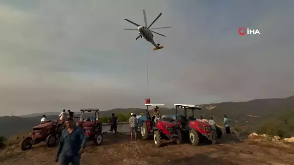 Köylüler yangına karşı seferber oldu: Tankerlerle helikopterlere su takviyesi